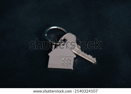 Keychain house with keys. Realtor, mortgage, your house, home loan concept. Copy space