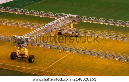 Assimilation lighting in soccer stadium. Lighting assimilation off grass. Aerial view of light therapie in stadium. The LED grass grow lights