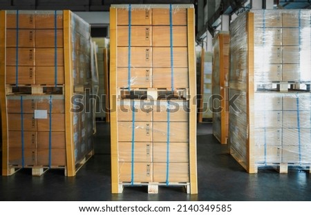 Packaging Boxes Stacked Wrapped Plastic Film with L-shape Pallet Corrugated Paper Cardboard Angle Corner Edge Protector. Storage Warehouse. Shipment Supply Storehouse. Shipping Warehouse Logistics.	
