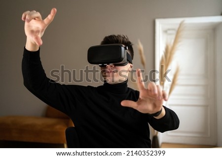 Uses virtual glasses Programmer break man in stylish clothes working in a coworking space