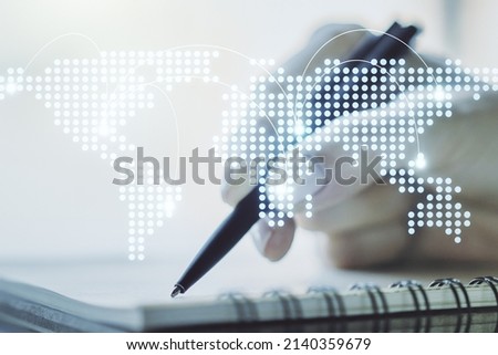 Double exposure of abstract digital world map with connections and woman hand writing in notepad on background, big data and blockchain concept