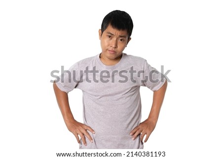 Portrait of young man holding hands on waist. Human emotion face expression concept. Studio shot isolated on white background. copy space