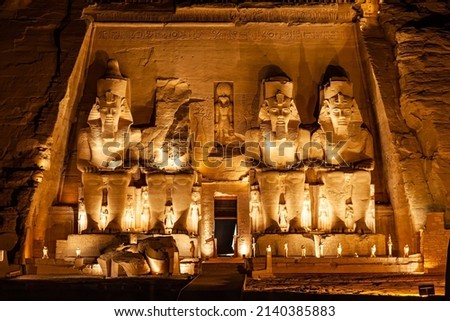 Statue of Pharaoh Ramses II in front of The Great Temple of Ramses II in Abu Simbel in the night, Aswan, Upper Egypt. Royalty-Free Stock Photo #2140385883