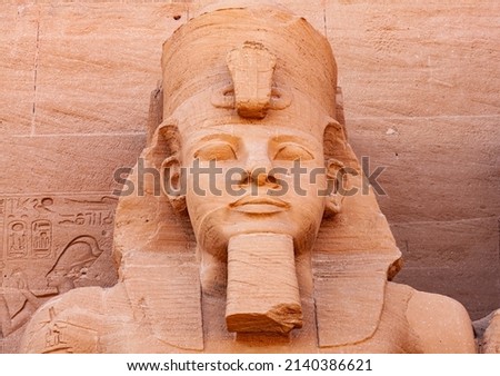 Zoom in View of Statue of Pharaoh Ramses II in front of The Great Temple of Ramses II in the village of Abu Simbel, Aswan, Upper Egypt. Royalty-Free Stock Photo #2140386621