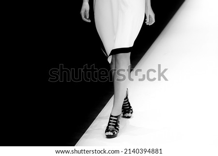 Fashion Show, CatwalkFashion catwalk runway event, model walking the show finale. Royalty-Free Stock Photo #2140394881