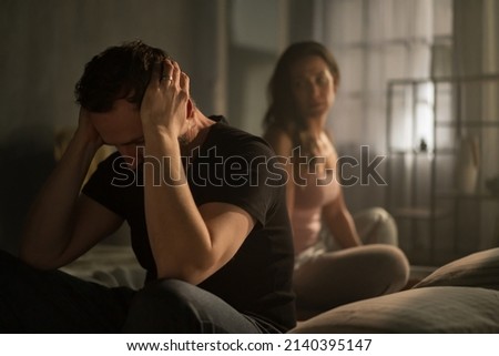 Husband and wife arguing in bed, relationship problems concept. Royalty-Free Stock Photo #2140395147