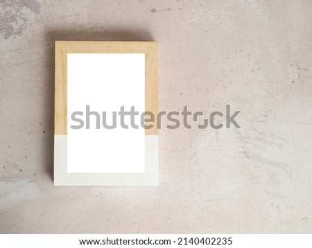Empty white wooden frame template on concrete background