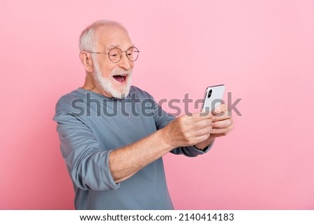 Photo of hooray elder grey hairdo man take picture wear eyewear blue shirt isolated on pink color background Royalty-Free Stock Photo #2140414183