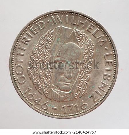 Germany - circa 1966: a 5 Deutsche Mark coin of the Federal Republic of Germany showing a portrait of the German philosopher, mathematician, jurist, historian Gottfried Wilhelm Leibniz 