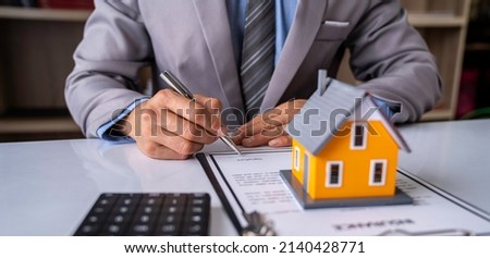 Signing home sales and insurance contracts with real estate agents, signing contracts to know the terms of buying and selling homes and real estate, contract signing ideas. Royalty-Free Stock Photo #2140428771
