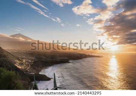 Amazing volcanic landscape with ocean coast during sunset. Teide volcano of Tenerife, Canary Islands.
