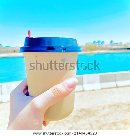 Nice picture on the beach on a sunny summer day and a refreshing cold coffee 
