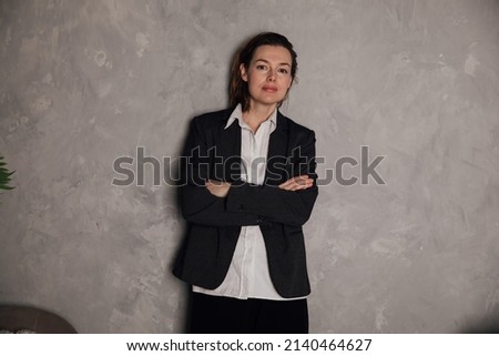 woman in a business suit at work in an office