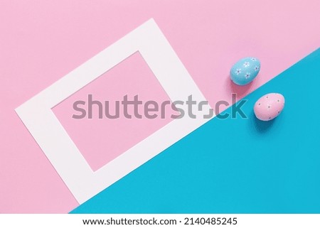 
Template with Easter eggs and frame on the pink and blue background