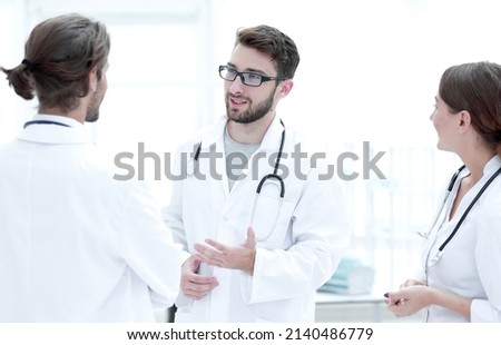 Medical staff discuss in a modern hospital room Royalty-Free Stock Photo #2140486779