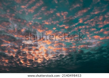 Middle level layered clouds . Altocumulus on the morning sky  Royalty-Free Stock Photo #2140498453