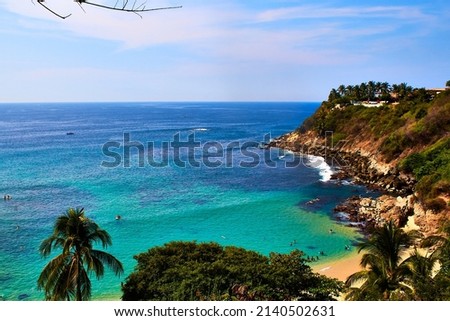 paradise mexican beach with turquoise water and blue sky in carrizalillo beach on puerto escondido oaxaca Royalty-Free Stock Photo #2140502631