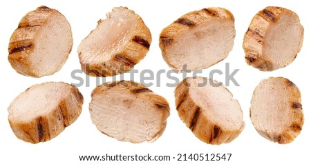 Grilled chicken breast slices isolated on white background Royalty-Free Stock Photo #2140512547