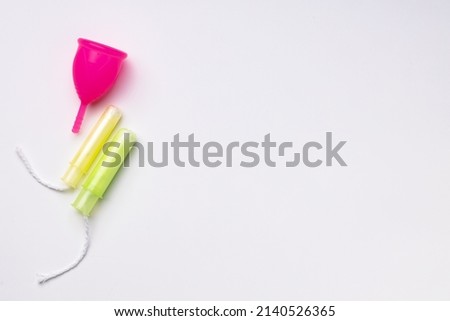 Top view of menstrual cup and medical tampon