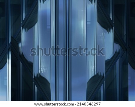 Abstract architecture of modern building with glazed windows. Close-up photo of glass panels and metal frames of facade wall. Fragment of business real estate. Geometric pattern of parallel lines.