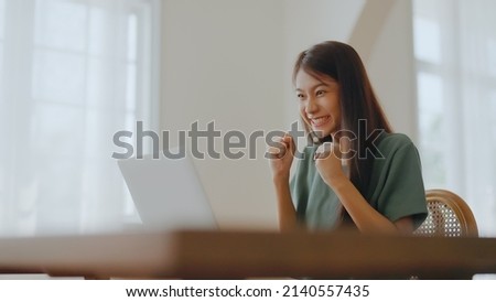 Excited asian female feeling euphoric celebrating online win success achievement result, young woman happy about good email news, motivated by great offer or new opportunity, passed exam, got a job Royalty-Free Stock Photo #2140557435