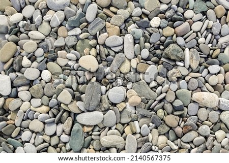 Stones, sea pebbles as a background, texture.