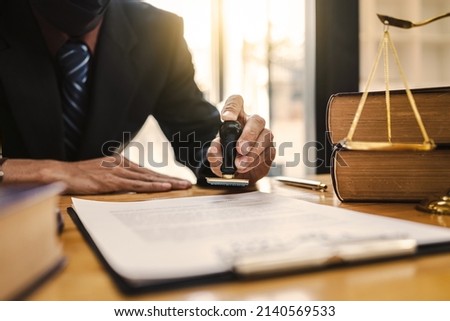 Business lawyer notary stamping agreement, company secretary, official document, validity. Royalty-Free Stock Photo #2140569533