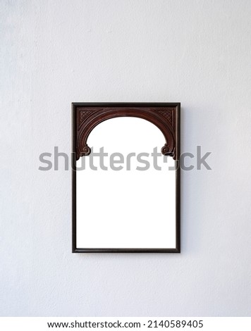 wooden frame on isolated white wall