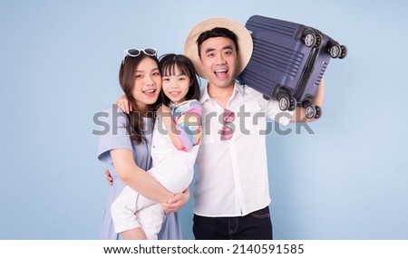 Image of young Asian family travel concept background
