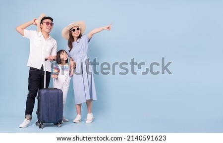 Image of young Asian family travel concept background Royalty-Free Stock Photo #2140591623