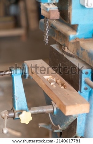 Powermatic Chain Mortiser in a factory Royalty-Free Stock Photo #2140617781