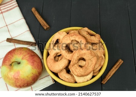 Fresh apples and dried apples on the table. Background with copy space. Artistic food concept on kitchen countertop