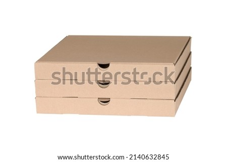 Brown pizza boxes stacked on top of each other, side view