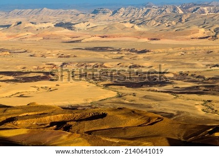 MITZPE RAMON, ISRAEL - 2 FEBRUARY 2022: A view of the Ramon Crater from the rim. Royalty-Free Stock Photo #2140641019