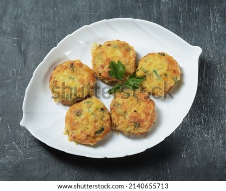 Potato cakes are a typical Indonesian side dish made from potatoes that are steamed and then crushed mixed with eggs, garlic, pepper and salt. Then it is shaped round and fried. Served on a plate
