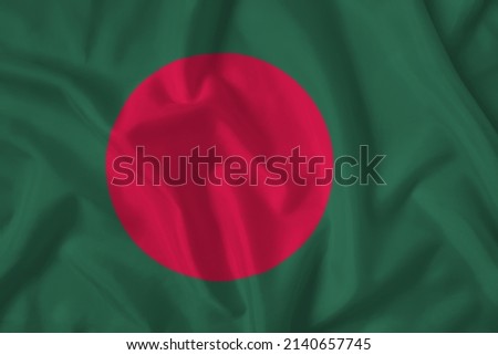 Bangladesh flag with fabric texture. Close up shot, background.