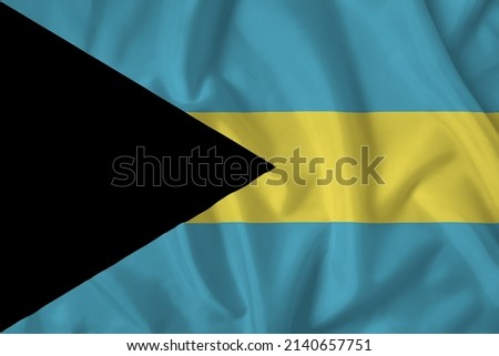 Bahamas flag with fabric texture. Close up shot, background.