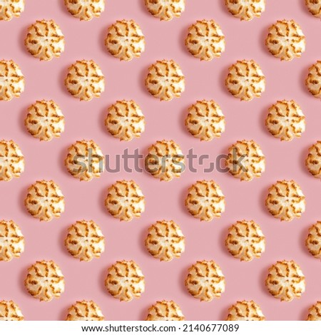 Seamless pattern with coconut macaroons for Jewish holiday Pesach on pink background.