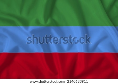 Dagestan flag with fabric texture. Close up shot, background.