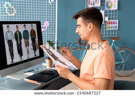Male fashion designer working in studio