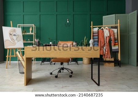 Workplace of clothes stylist in studio