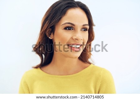 Shes a brunette beauty. Studio portrait of a gorgeous young woman posing against a light background.