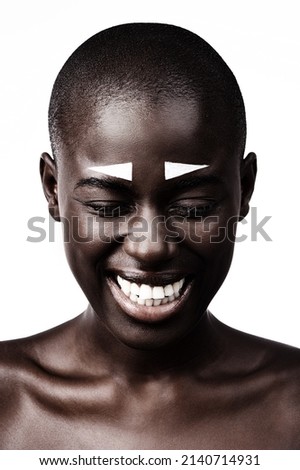 Beauty is found in the simplest form. Shot of a beautiful woman smiling against a white studio background.
