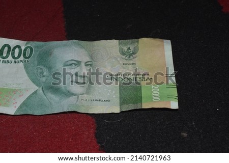 twenty thousand rupiah which is the currency of the state of Indonesia as a legal payment