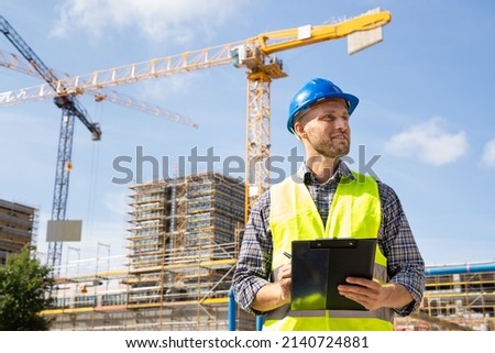 OSHA Inspector At Construction Site. Young Engineer Worker Royalty-Free Stock Photo #2140724881