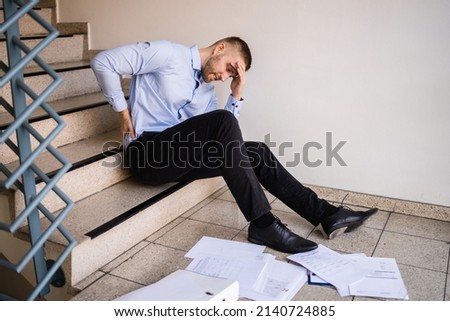 Fall And Fall Injury Accident At Workplace. Man Fell Down Stairs Royalty-Free Stock Photo #2140724885