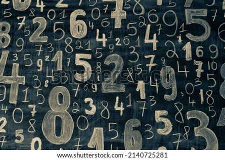 picture with random numbers drawn with chalk on the board at university or school. Math lesson with formulas and numbers