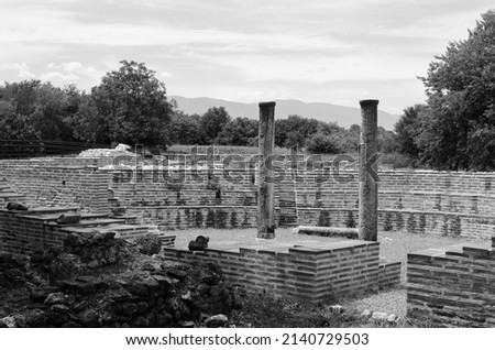 Monochrome view of ancient ruins at the archaeological park of Dion, Greece.