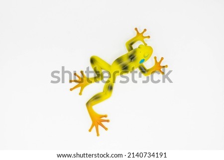 Yellow frog, toys for kids on a white background.