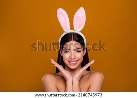 Photo happy asian lady bunny ears head hold arms under chin make procedures facial care isolated pastel background